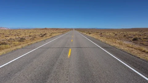 Driving On An Empty Highway Passing Through The Hot Desert Steppe Aerial View 스톡 동영상 120731876
