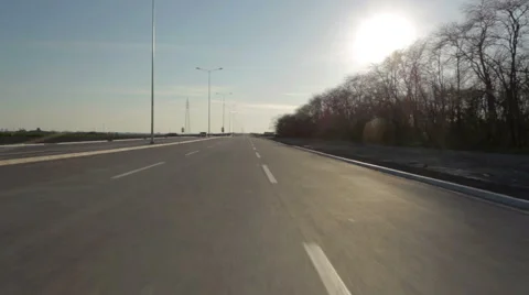 Driving on an empty highway towards the sun HD 30 fps Stock Footage 49109542