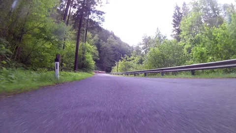 Driving on an empty mountain road near lake langbathsee, ebensee, upper austria Stock Footage 133311386