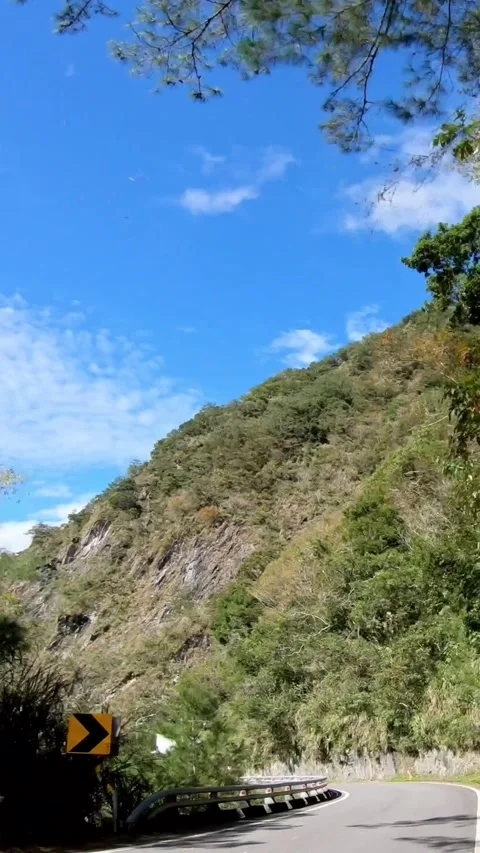Driving on empty mountain road through forest with curves in Taitung. Stock Footage 318840821