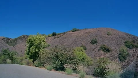 Driving on an empty road along a highway, Los Angeles Stock Footage 343475729