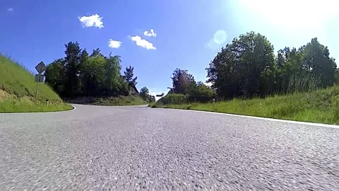 Driving on an empty road in the austrian region waldviertel Видео 131839384