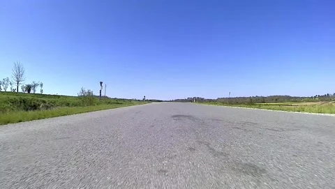 Driving on an empty road in the austrian region weinviertel in spring Видео 132086692