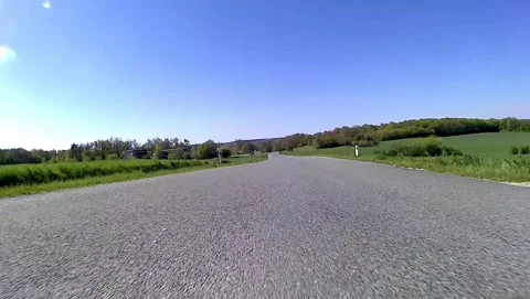 Driving on an empty road in the austrian region weinviertel in spring Stock Footage 132086706