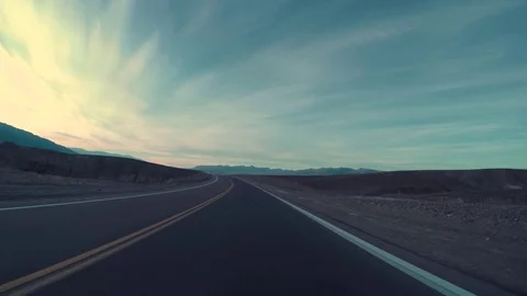 Driving On Empty Road In Desert, Car Headlights In The Distance At End Of Clip Stock Footage 69873213