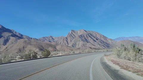 Driving on an Empty Road Desert Sunny Day Blue Sky Video stock 223603698