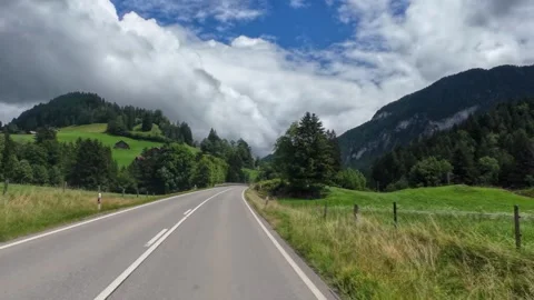 Driving Empty Road with Golden Grass Hillside Stock Footage 341366285