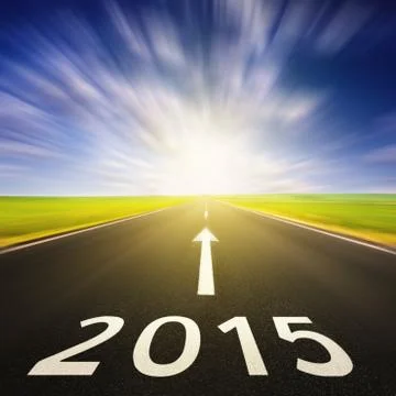 Driving on an empty road in speed to 2015 写真素材