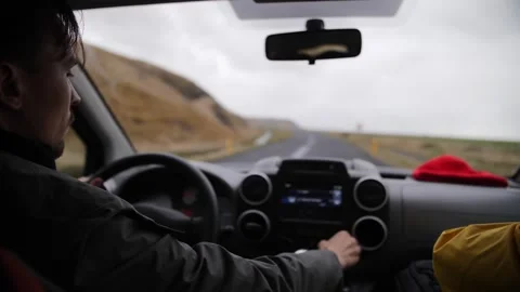 Driving on an empty road through Icelandic landscape Stock Footage 306523729