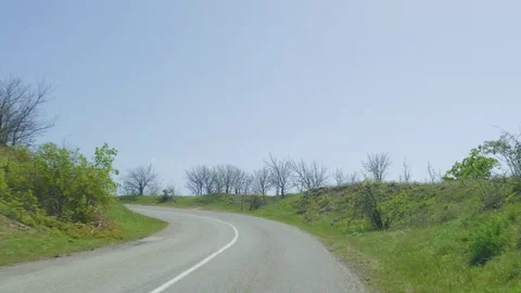 Driving On Empty Road Through Serpentine Mountains Tight Stock Footage 77634734