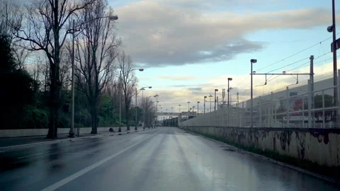 Driving on empty wet road in the morning in Lisbon Stock Footage 273673411