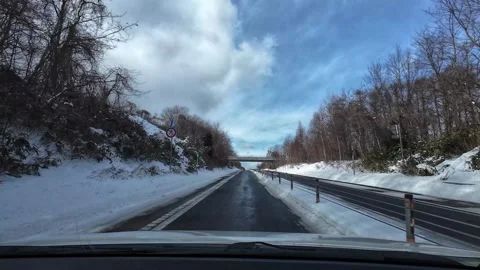 Driving on empty winter highway through forest no traffic Video stock 333091227