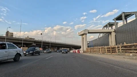Driving the Expanding Cairo Ring Road Network with Real Traffic and City Views Stock Footage 330075458