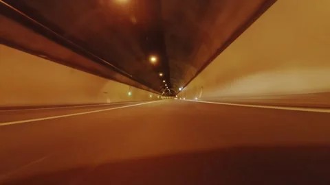 Driving Experience Through a Tunnel at Night Stock Footage 332745007