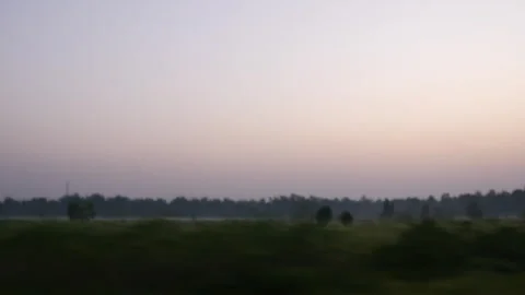 Driving by fast with a beautiful view of evening sky and treeline Stock Footage 281221630