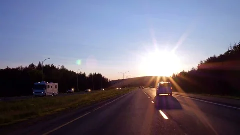 Driving fast on the highway at sunset Stock Footage 92393682