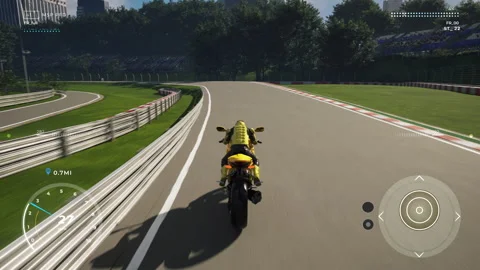 Driving a fast yellow motorcycle in a virtual circuit in a racing game level Stock Footage 305928041