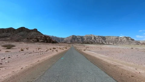 Driving footage on an empty old Desert road in wide view and lens flare. Stock Footage 108514905