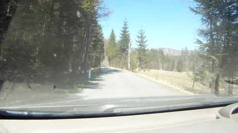 Driving on a forest road in the austrian alps Stock Footage 127628587