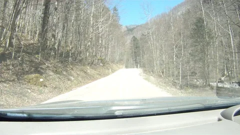 Driving on a forest road in the austrian alps Stock Footage 127628641