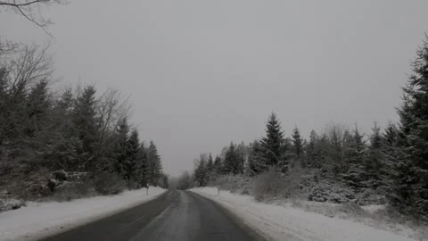 Driving in a forest winter with snow in Germany Stock Footage 326995618