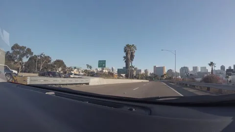 Driving on Freeway Exit Ramp into Downtown City Streets Stock Footage 344608579
