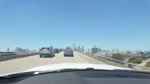 Driving on the freeway in heavy traffic with skyline of the city. San Francisco. Stock Footage 281927963