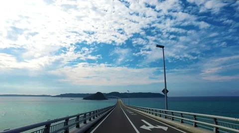 Driving to a future, Tsunoshima bridge over ocean Stock Footage 68430322