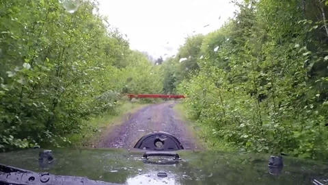 Driving up to gate on logging road Stock Footage 173352591