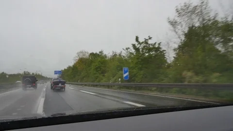 Driving on a German highway in rain Stock Footage 75065409