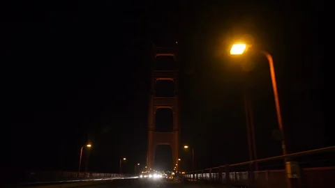 Driving on Golden Gate Bridge at Night Looking Up Stock Footage 101445996