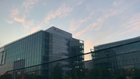 Driving by Google Cloud's main campus building in Mountain View, Stock Footage 129902613