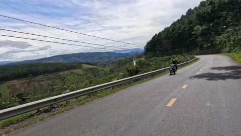 Driving in green mountains. point-of-view. Sunny day. Lam Dong province, Vietnam Stock Footage 239216774