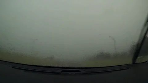 Driving in heavy downpour under a bridge Stock Footage 36789514