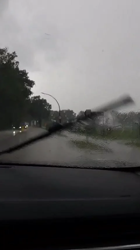 Driving in Heavy Rain at Dusk with Windshield Wipers Moving Stock Footage 340531367