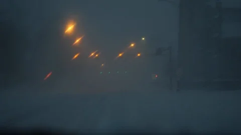 Driving in Heavy Snow with Windsheild Wipers Clearing off Snow Stockbeeldmateriaal 104890507