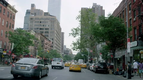 Driving in Hell's Kitchen past Mercury Bar on 46th st behind a taxi cab traffic Stock Footage 52328780