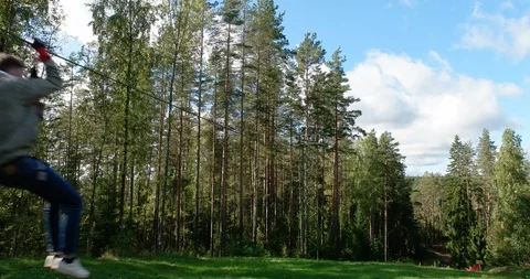 Driving at high speed on a cable stretched between trees, Climbing park "Nut" Stock Footage 88995766