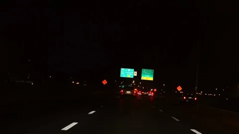 Driving on highway 20 at night close to Montreal Downtown Stock Footage 85069680