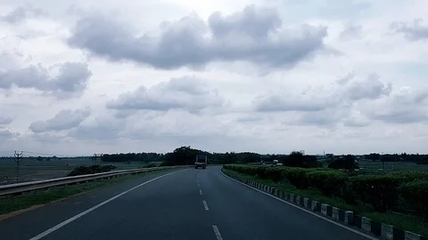 Driving in highway on a cloudy day during day time Stock Footage 113289181
