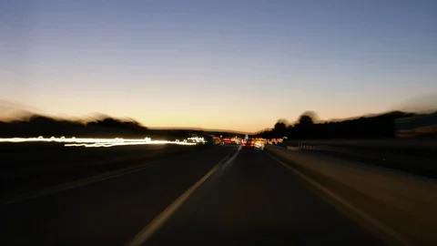 Driving on a highway at dusk Stock Footage 91868223