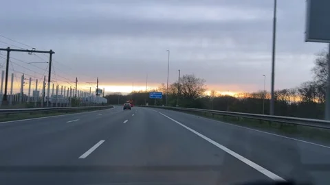 Driving on a highway at evening with serene first-person perspective from a 스톡 동영상 342756583