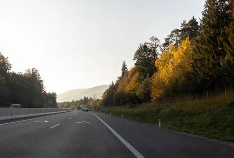 Driving on highway first panoramic view on mountains Stock Photos