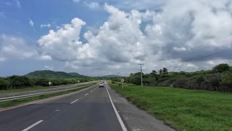 Driving Highway with Green Fields and Distant Hills 库存影片 341368845