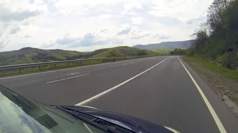 Driving on the highway in the mountains. Stock Footage 69123233