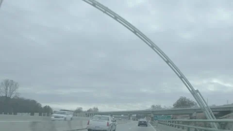 Driving on Highway Passing Under Pedestrian Arch Bridge 库存影片 343936965