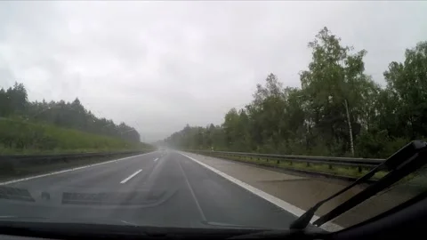 Driving a highway in the rain Stock Footage 172063327