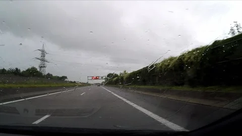 Driving a highway in the rain Stock Footage 172064033