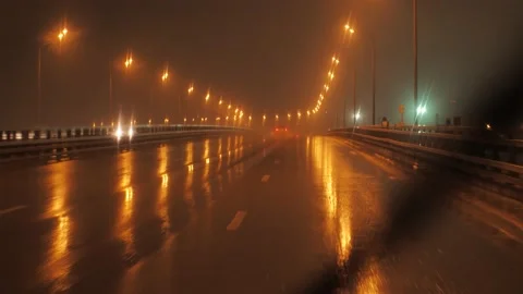 Driving on highway at the rain at night Stock Footage 154735604