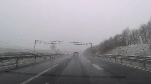 Driving on the  highway in the snow. Hyperlapse of driving in Slovenia Stock Footage 153280023